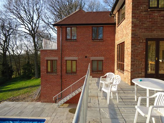 Two storey rear extension and swimming pool