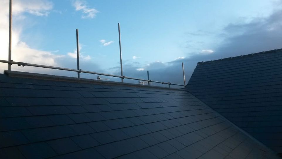 A finished roof valley after being repaired from the effects of seasonal weathering